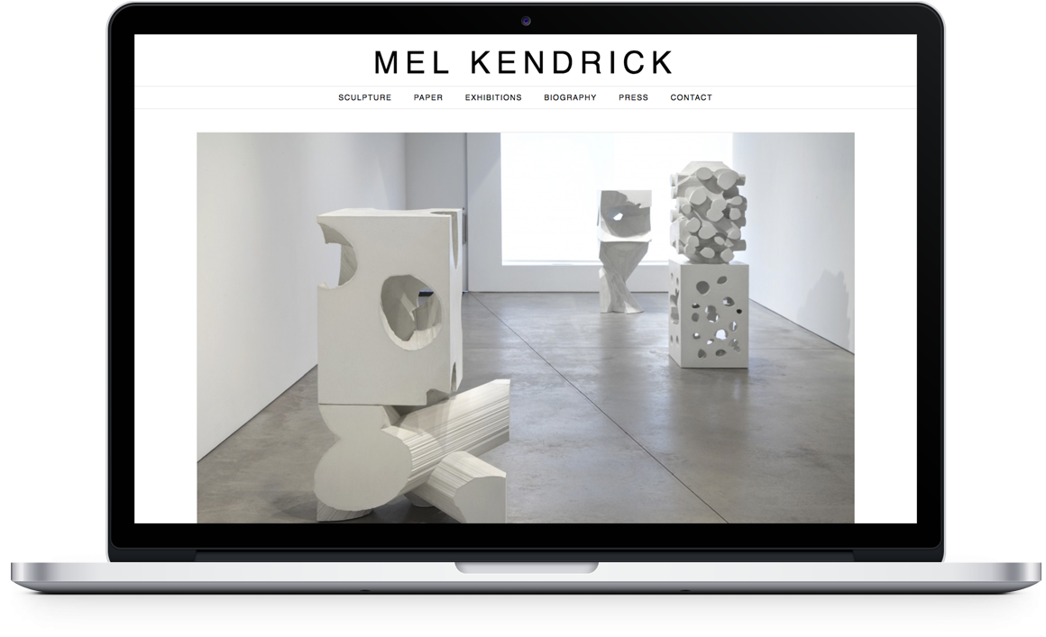 Mel Kendrick Home Page on laptop